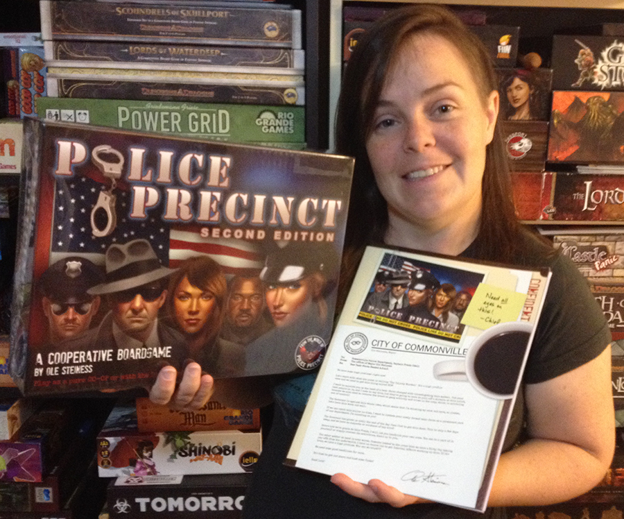Molly holding Police Precinct from Common Man Games.
