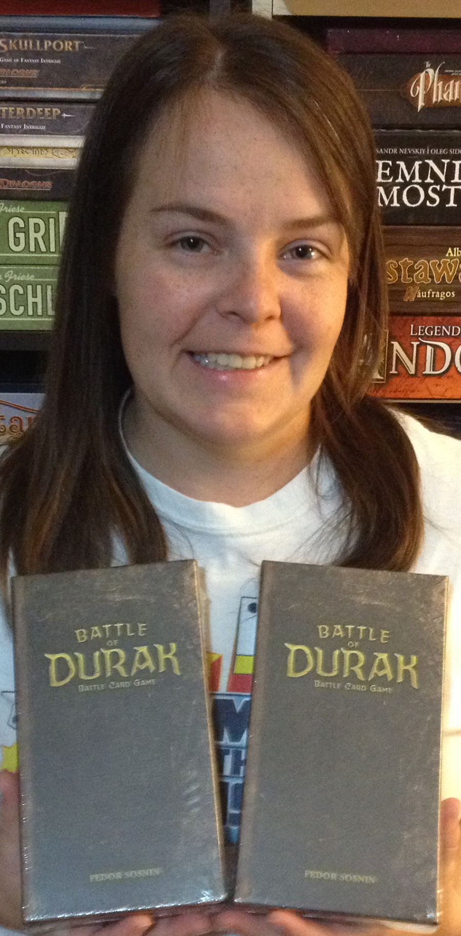 Molly holding two copies of Battle of Durak
