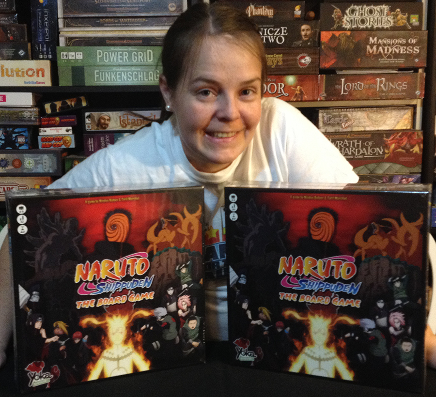 Molly with two copies of Naruto Shippuden board game